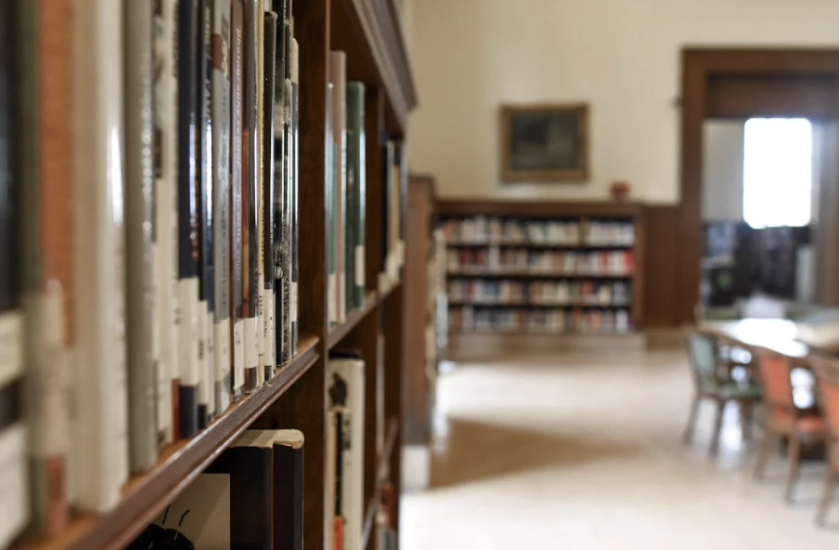 Image of a book shelf in a library